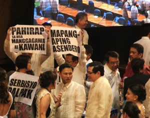 Placards raised by the Makabayan bloc after Aquino's SONA. Photo by Boy Bagwis