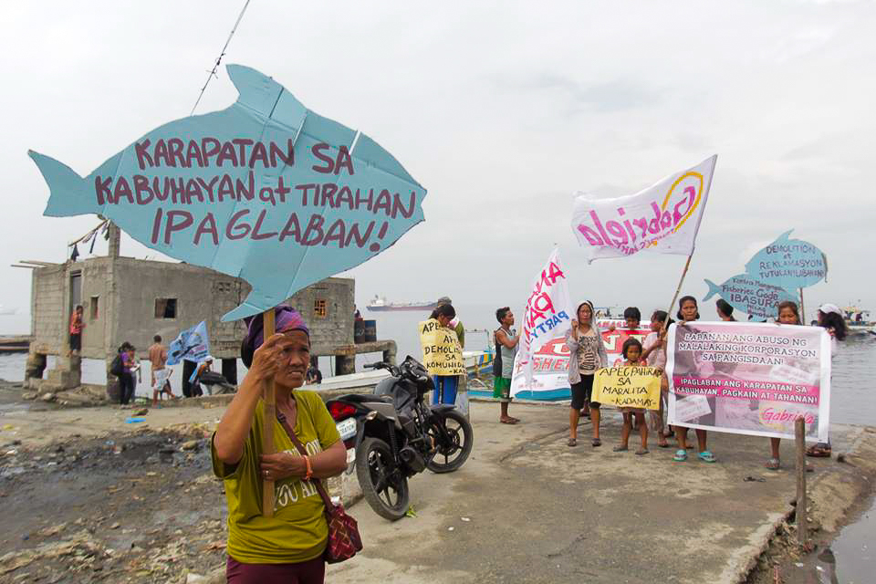 November 18: At the Navotas Fishport, small fisherfolk protest the "Blue Economy" peddled by APEC, which will further open up the country's marine resources to large commercial fishing. Photo by Tudla Productions.